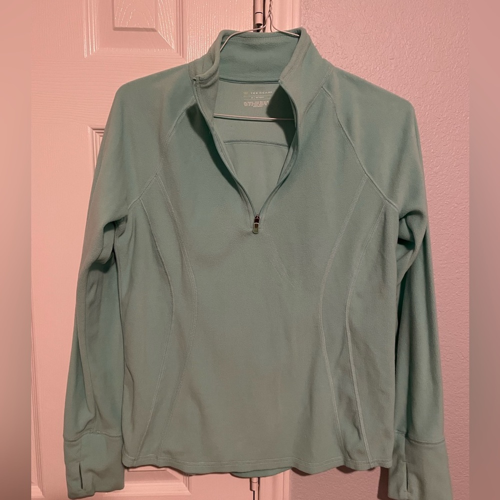Teal quarter zip sweatshirt.